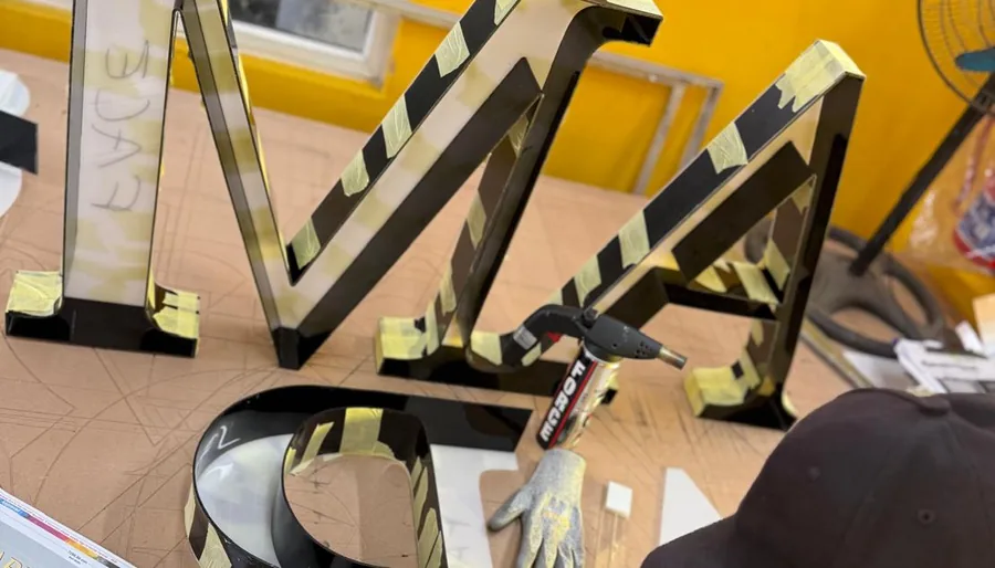 Built-up channel letters being prepared on the workbench at Umhlanga Signs